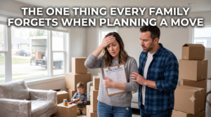 Stressed mother looking at moving checklist with worried expression while father points and young child plays in background surrounded by cardboard boxes during home move, illustrating the moment families realize they forgot something important